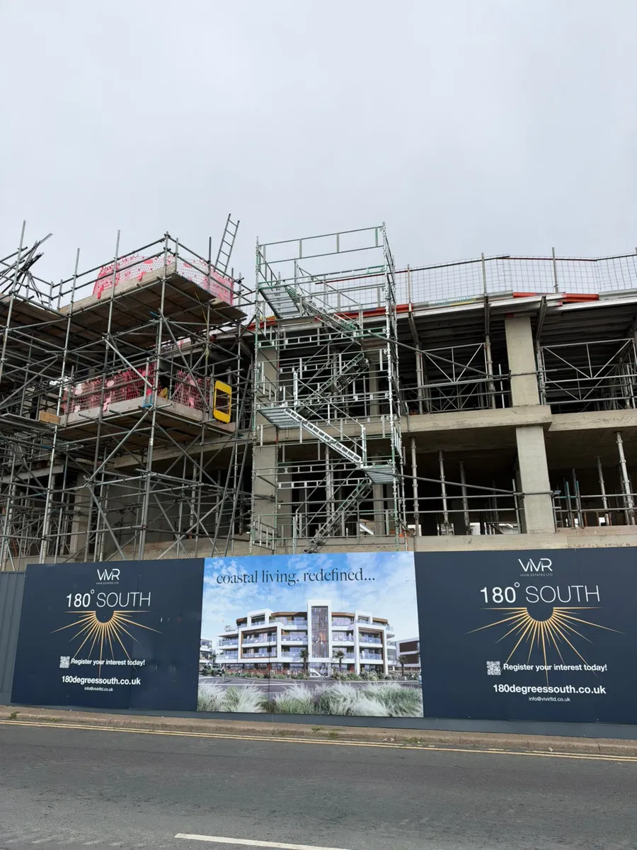 Front view of the HAKI staircase tower and surrounding building scaffold