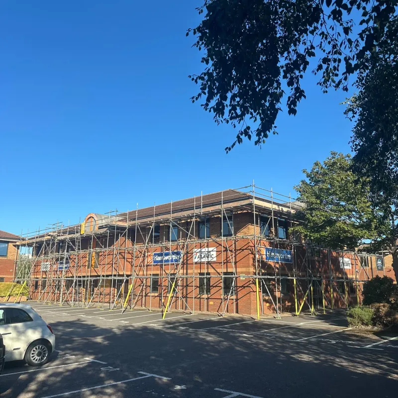 Front view of scaffolding around the commercial building at New Fields Business Park, Poole