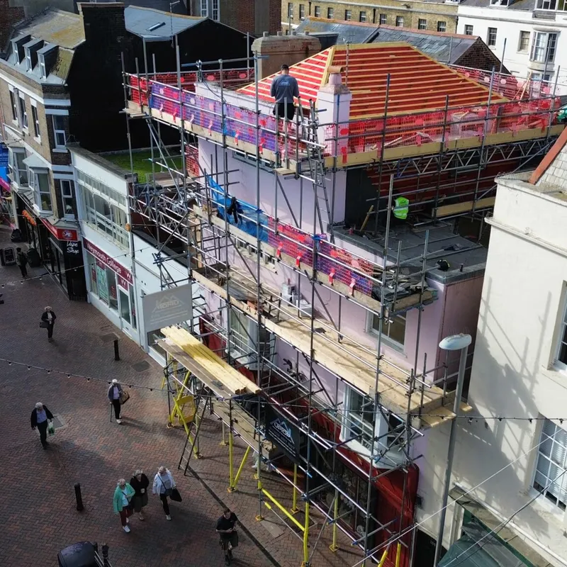 Scaffolding installation by Up Top Scaffolding on a commercial building in Bournemouth town centre high street – safe access and temporary roof system.