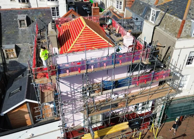 Full access scaffolding erected by Up Top Scaffolding for roof replacement project in Weymouth town centre.