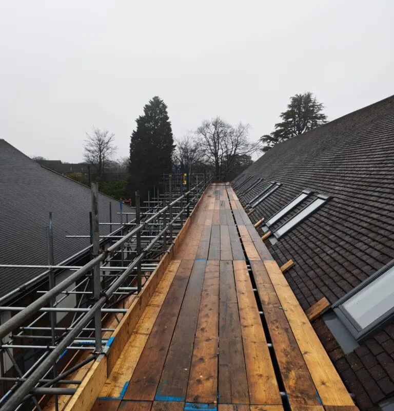 Ridge-level scaffold walkway erected by Up Top Scaffolding at Crowborough Town Council for solar panel installation works. Specialist roof scaffolding Crowborough East Sussex. Solar panel scaffolding TN6, scaffolding company Crowborough, Up Top Scaffolding