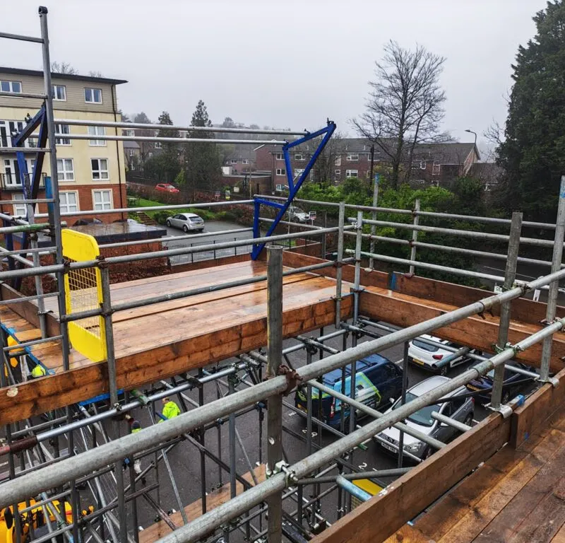 Elevated scaffold platform with full safety guarding at Crowborough Town Council solar panel installation. Up Top Scaffolding delivering complex multi-level scaffolding East Sussex. Solar scaffolding Crowborough TN6, commercial scaffolding East Sussex, sca